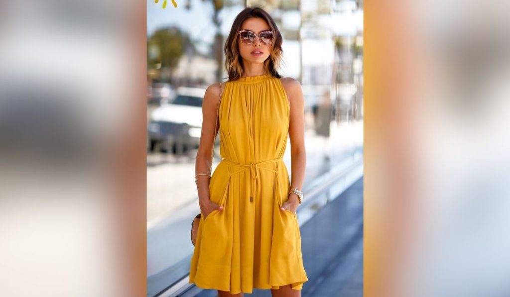 Woman wearing yellow summer dress