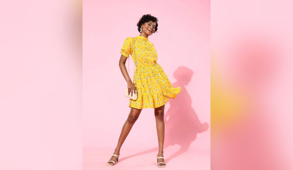 Woman wearing summer yellow dress